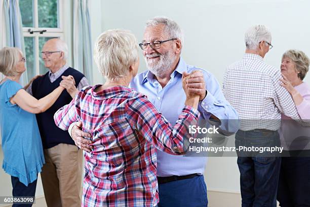 Group Of Seniors Enjoying Dancing Club Together Stock Photo - Download Image Now - Ballroom Dancing, Dancing, Senior Adult