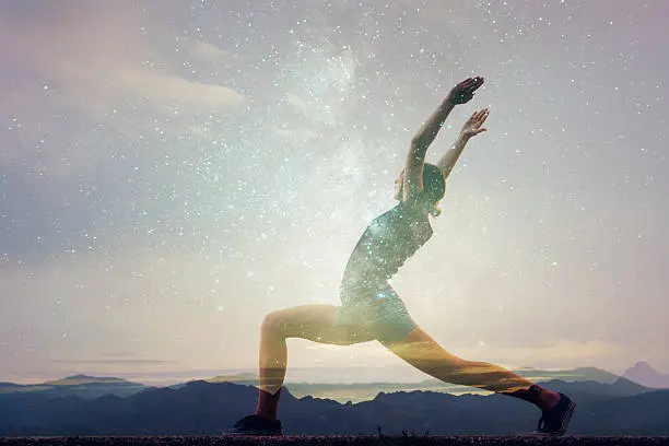 Photo of Double exposure of woman doing yoga and starry sky