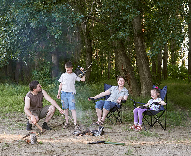 istock people camping in forest, family active in nature, kindle fire 603864878