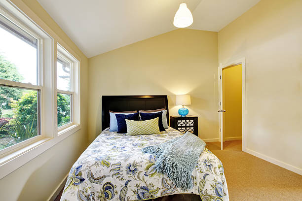 istock Bedroom interior with beige walls and nice bedding 603864996