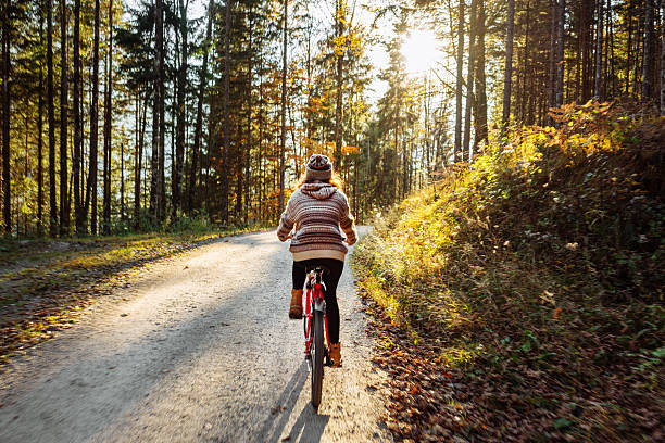 istock Woman on bicycle in forest 603866538