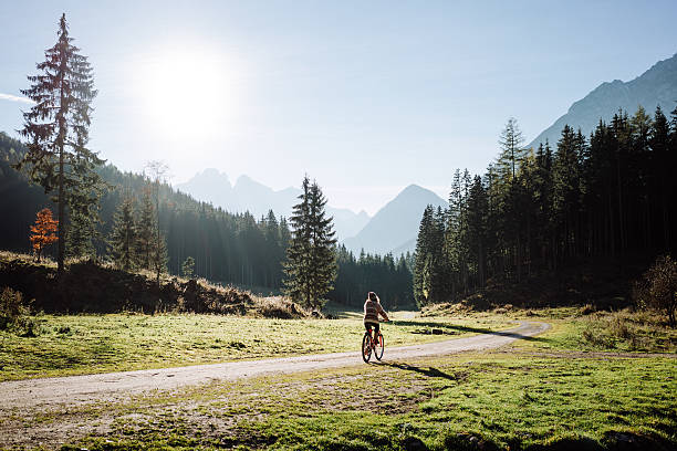 istock Woman on bicycle in forest 603866562