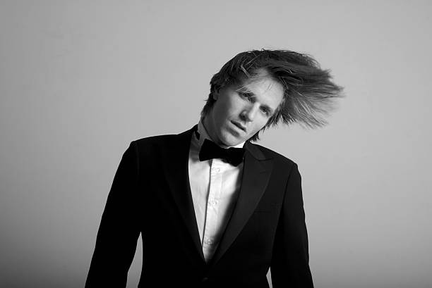 young man with long shaggy hair in tuxedo - anti smoking imagens e fotografias de stock