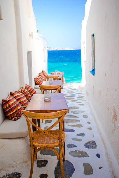 istock Benches with pillows in a typical greek bar in Mykonos 603878800