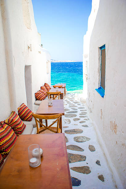 istock Benches with pillows in a typical greek bar in Mykonos 603879226