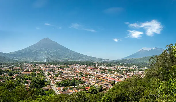 Panoramic view of Antigua Guatemala with the three volcanoes in the background
