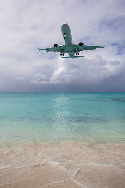 istock Airplane Landing near Beach 603898384