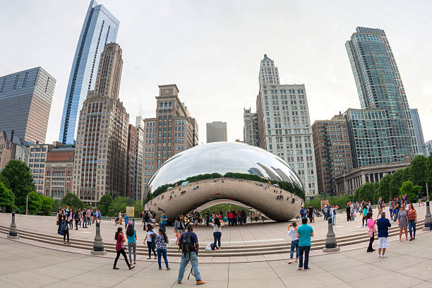 Downtown Chicago the Bean Chicago, Illinois, USA - June 4, 2016: The Cloud Gate sculpture, also known as "the Bean", is a tourist magnet and a must see for anyone planning a memorable visit to the "windy city". millennium park stock pictures, royalty-free photos & images