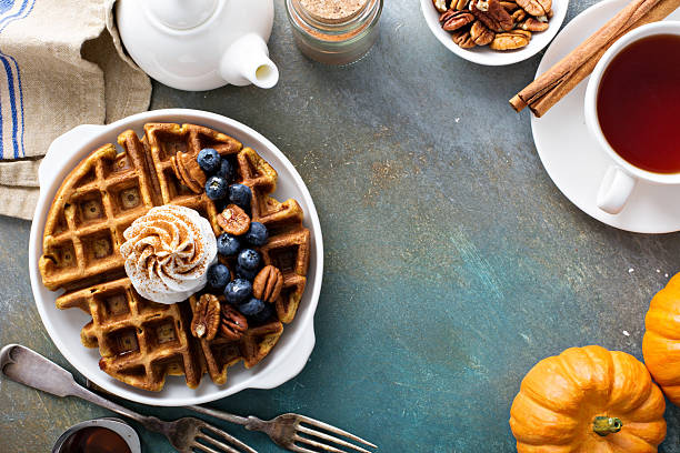 istock Pumpkin waffles with whipped cream for breakfast 603903436