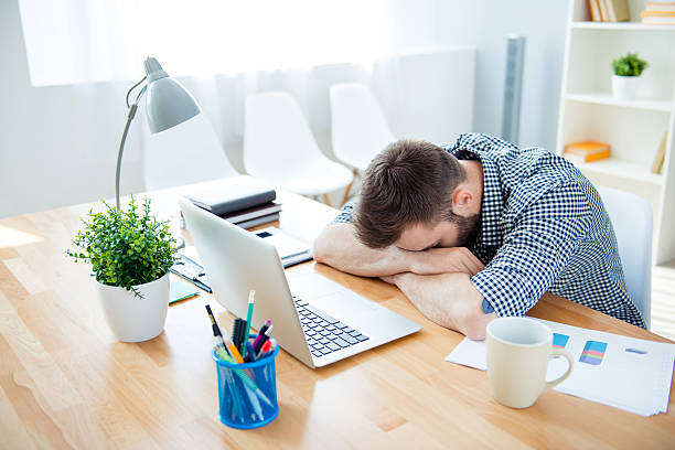 istock Exhausted man sleeping at workplace  after hard working day 603903772
