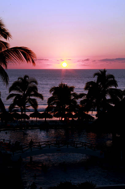 istock Landscape sunset on the beach with palm trees 603904284