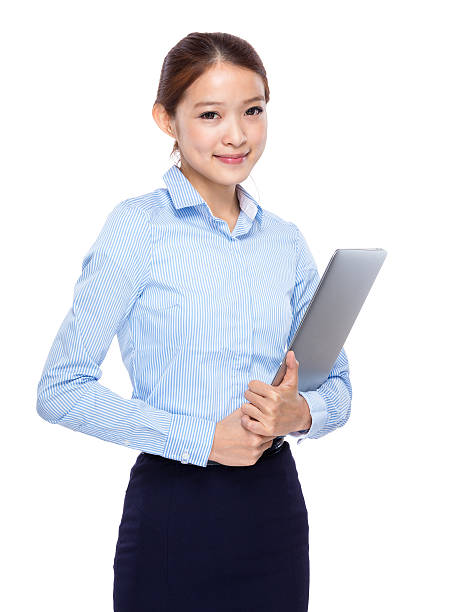 istock Woman holding a laptop 603905728
