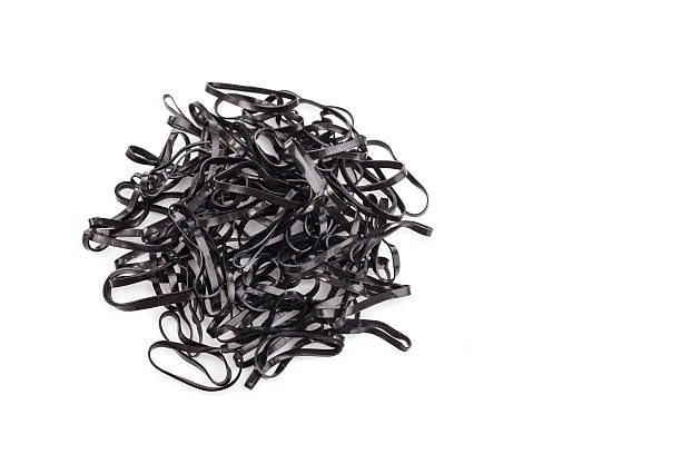 istock Pile of black rubber ring isolated on white background 603906244
