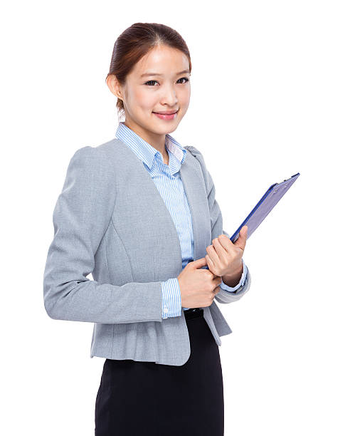 istock Businesswoman holding a clipboard 603907162