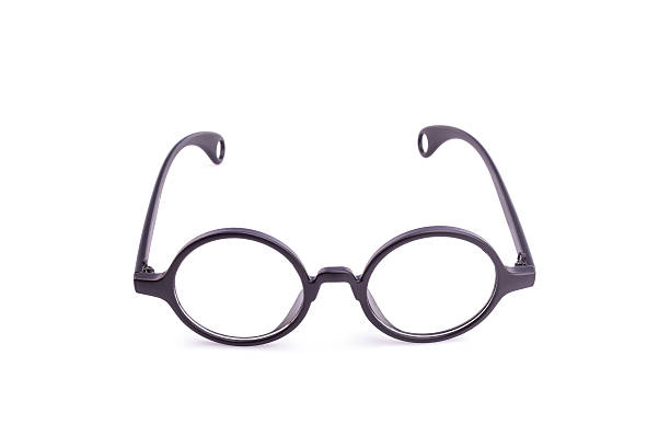 istock Close up black eye glasses isolated on white 603907592