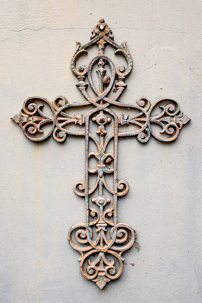 istock Metal cross against a wall 603907812