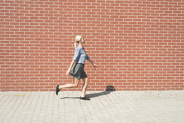 istock Happy blonde woman goofing around 603909160