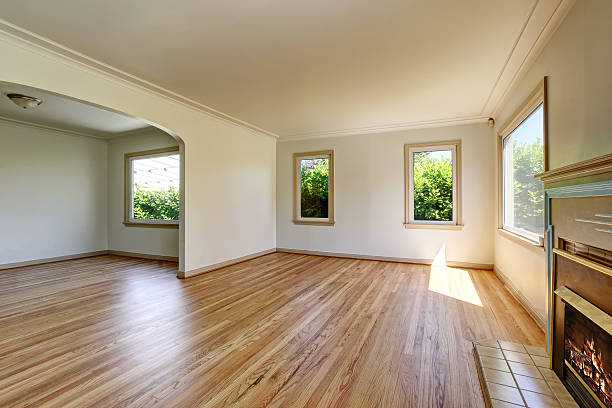 istock Open floor plan empty living room with polished hardwood floor. 603910366