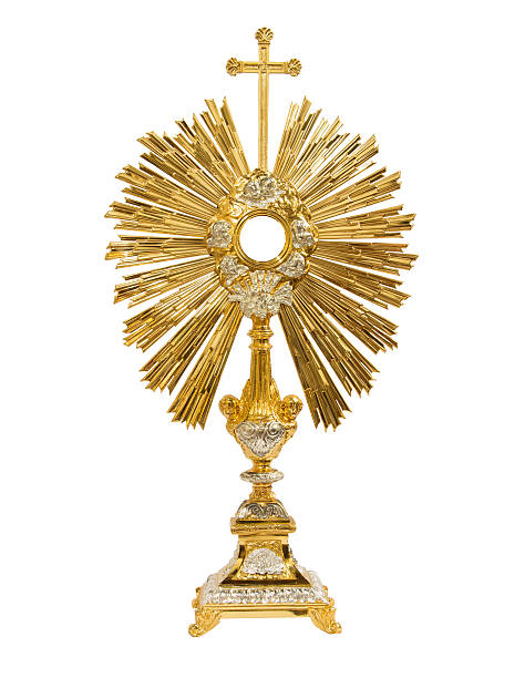 istock Old gold monstrance on white background 603911258
