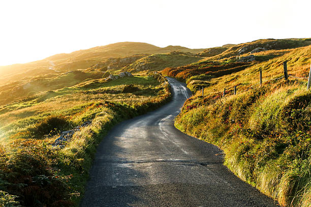 Sky Road, Clifden, Ireland The perfect sunset light led us along the beautiful coast of Clifden, located in the west of Ireland. hit the road stock pictures, royalty-free photos & images