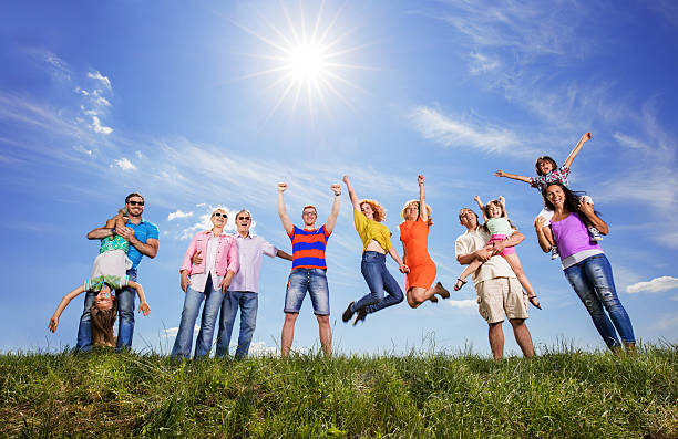 istock Large group of playful people having fun against the sky. 603912066