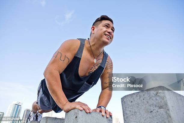 Fit Man Excercising In Urban Auckland City Buildings Pacific Islander Stock Photo - Download Image Now