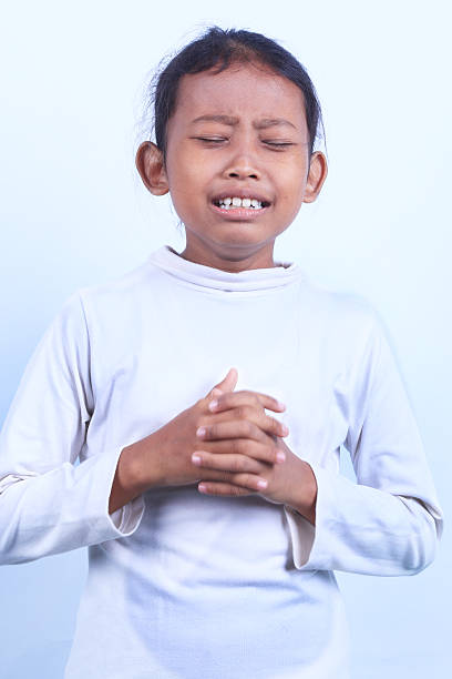 istock crying girl on white background 603986460