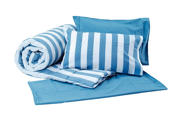 Pillows and blanket Blue set of pillows and blanket isolated on white background with clipping path. bedding stock pictures, royalty-free photos & images