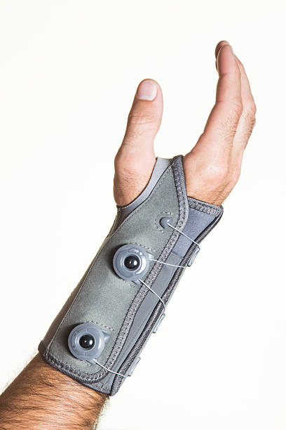 Bandage wrist with pressure regulator on man's hand - isolate Bandage wrist with pressure regulator on a man's hand - isolate on a white background pollex stock pictures, royalty-free photos & images