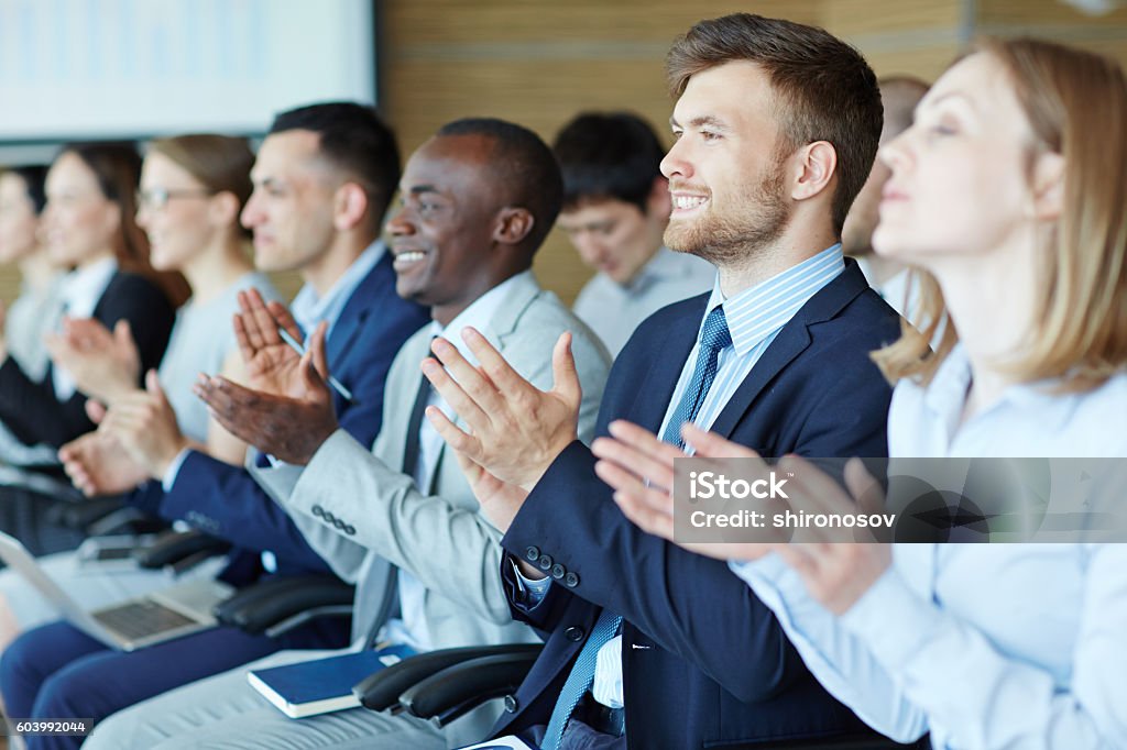 People at business training People applauding to the speaker at conference hall Meeting Stock Photo