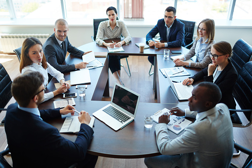 Corporate Event: Caucasian Female Tech CEO Giving Presentation To Colleagues or Investors In Conference Room Of Innovative Startup Company Office. Successful Woman Talking About Business Objectives.