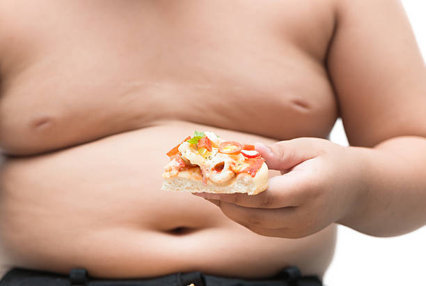 istock Seafood pizza in hand obese fat boy 603993458