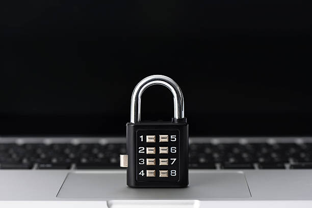 istock Locked padlock on laptop with shallow depth of field 603993772