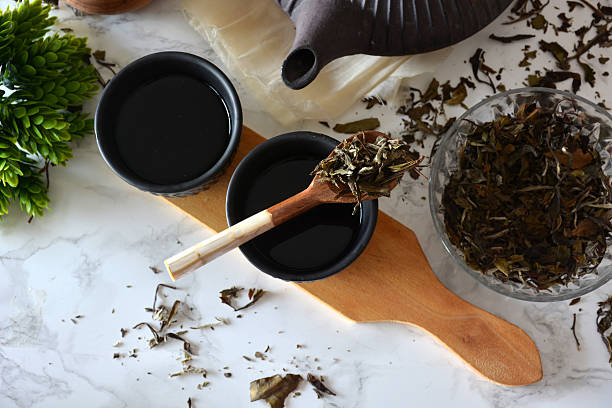 istock cups of black tea with teapot 603993964