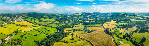 istock Aerial panorama over green patchwork fields idyllic rural landscape Cotswolds 603995344