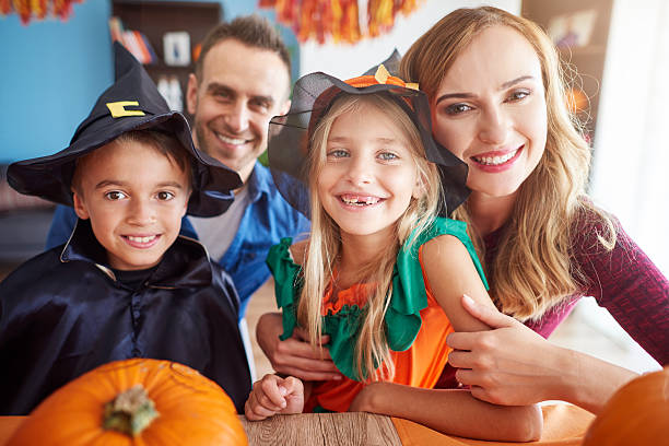 istock Happy family during halloween celebration 603995632