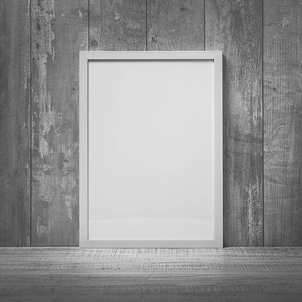 istock Blank white picture frame on the wall and the floor 603996726