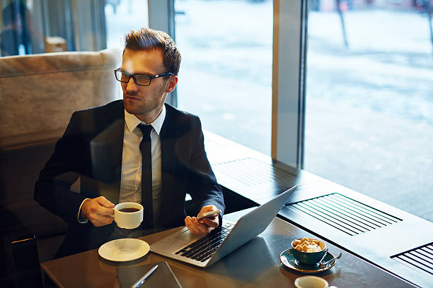 istock Businessman in cafe 603996762