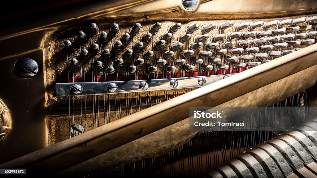 inside a piano, wooden parts, mechanisms closeup inside piano mechanisms, wooden hammers, mechanisms details closeup Harpsichord Stock Photo