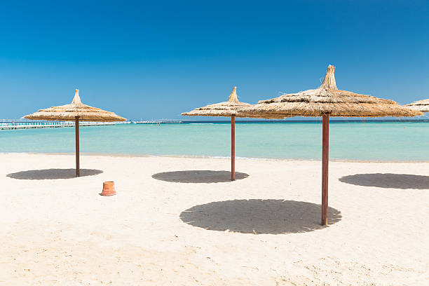 istock Sunshade umbrellas on the beach 603999520