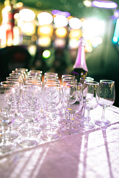 istock flute glasses with champagne bottle 603999660