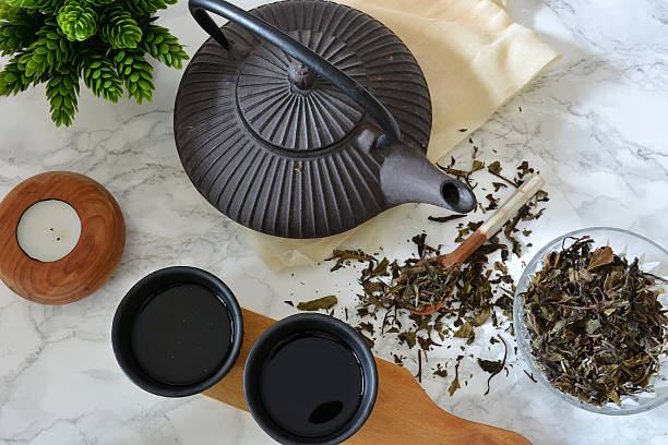cups of black tea with teapot stock photo
