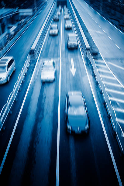 istock car driving on city road 604003280