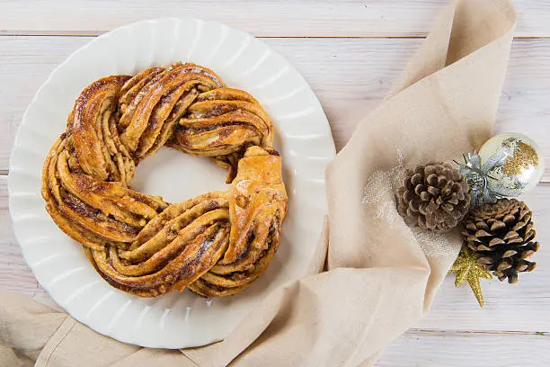 Kringle or pretzel, traditional Christmas dessert in Northen Europe with cinnamon and walnuts