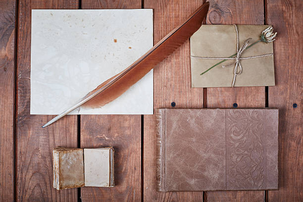 istock Blank paper on a wooden surface. Vintage set of object 604003932