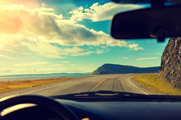 istock Driving a car on mountain road 604004822