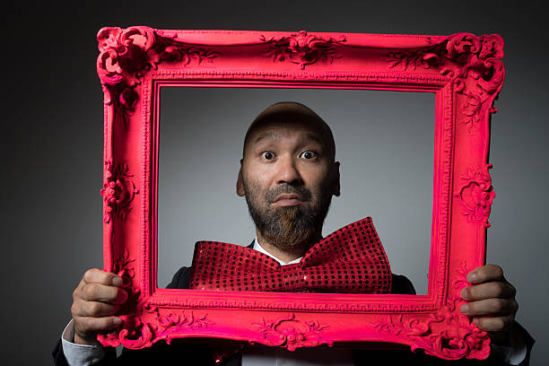 istock Portrait of a man and a frame. 604005080