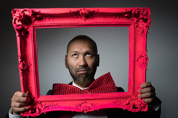 istock Portrait of a man and a frame. 604005216
