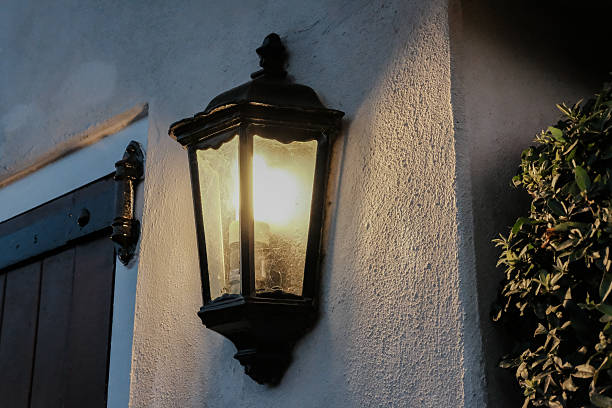 istock Solitary security lantern seen by a garage door 604005232