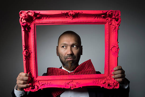 istock Portrait of a man and a frame. 604005286